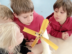Children building wind turbines in an Inventors and Makers Engineering and Environment workshop