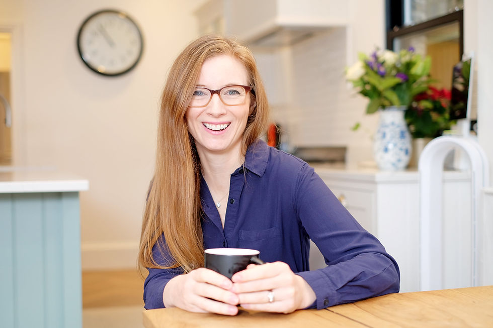 Laura Cross at table in a kitchen