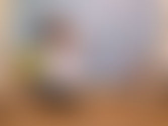 Lady in lab coat with yellow balloon