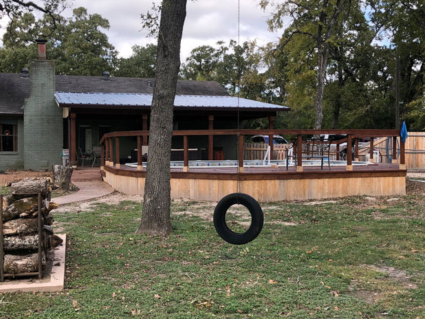 side view of wood patio surrounding pool