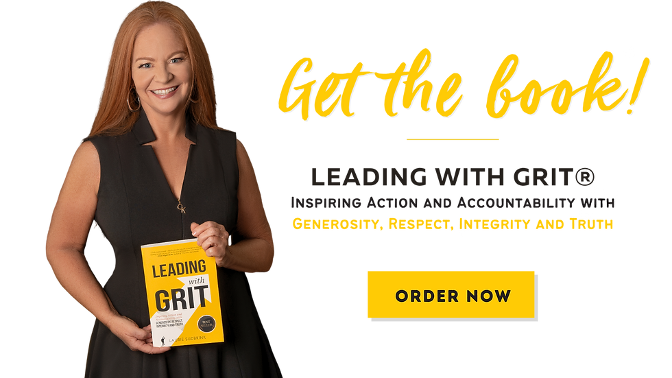 woman holding a book titled Lead with Grit