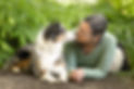 Wendy and her young Australian Shepherd lie face-to-face