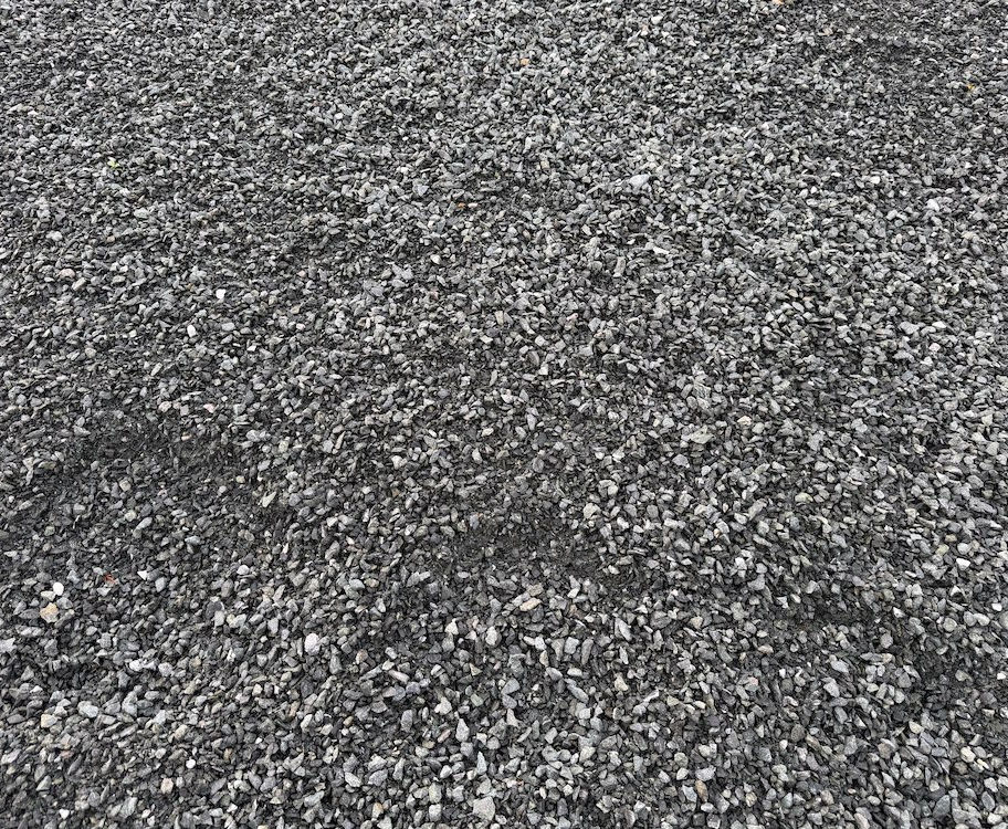 Close-up of 12.5 mm crusher dust showing fine crushed aggregate and compactable texture