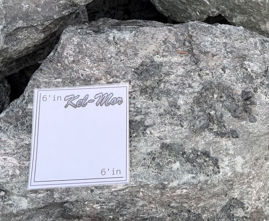 12 to 24 inch plus rip rap rock with size scale showing oversized angular rock for shoreline protection and slope stabilizati