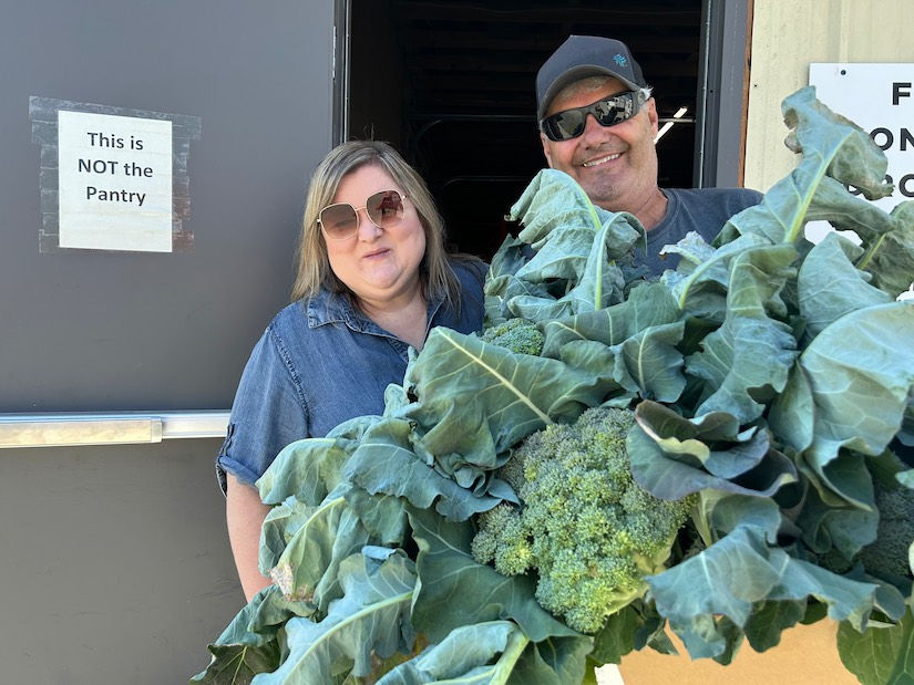 Bob and Jessica with donated produce grown in community garden