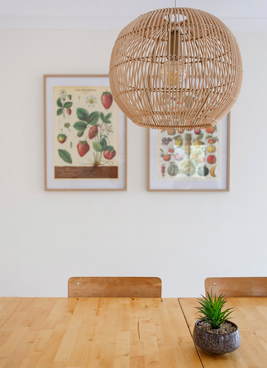 Posters on the wall in villa's dining room 