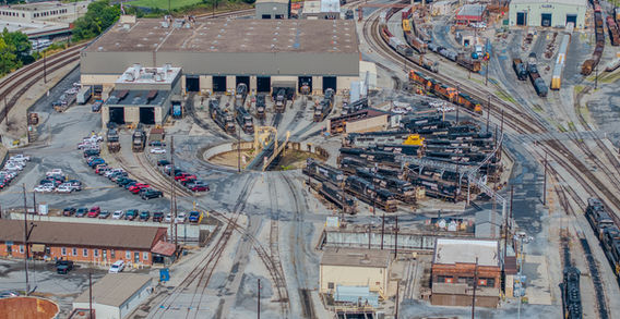 Aerial view of a large train yard with various tracks. Aerial Imaging Services. Train Photography.