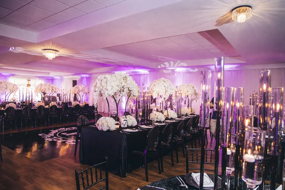indoor party with black chairs.webp