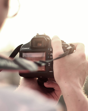 man camera taking photo photographer