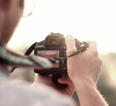 man camera taking photo photographer