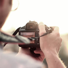 man camera taking photo photographer