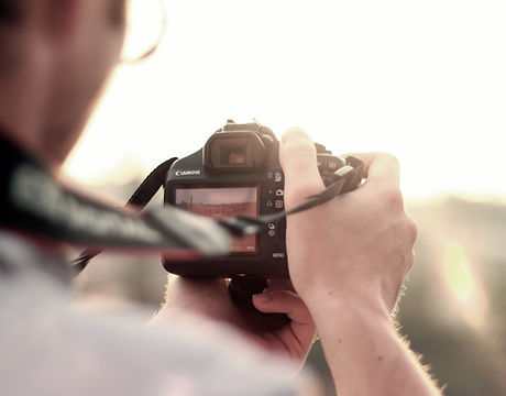man camera taking photo photographer