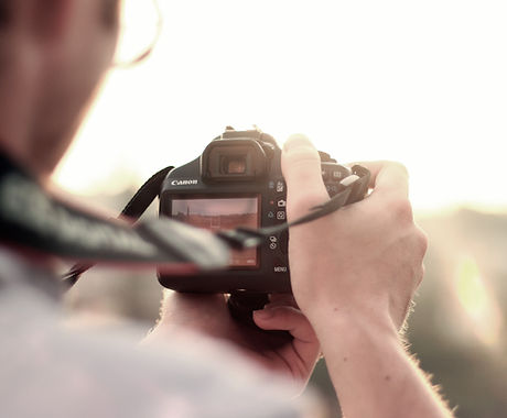 man camera taking photo photographer