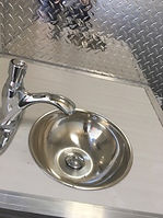 Sink with self cancelling tap.jpeg