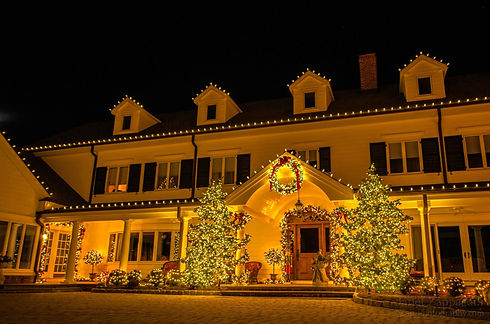 Side shot of a house with holiday lighting
