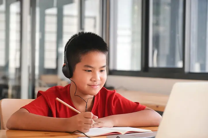 Child learning English online with an ESLVista teacher during a 1-on-1 lesson