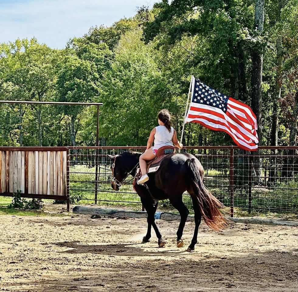Pat Hooper's daughter carrying the American flag.
