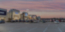 Blurred image exterior view of empty parking lots in modern shopping center in Humble, Tex