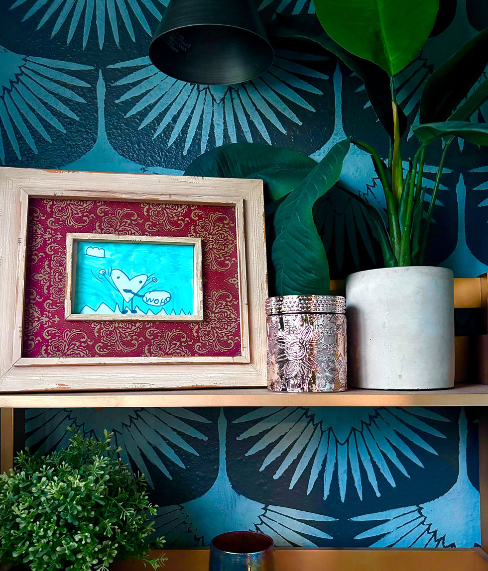 Thumbnail: a candle in front of a patterned wall on a shelf