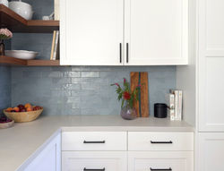 blue tile, white cabinets,