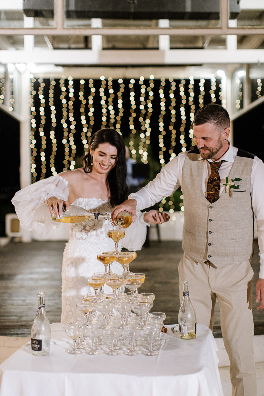 champagne tower, bride and groom