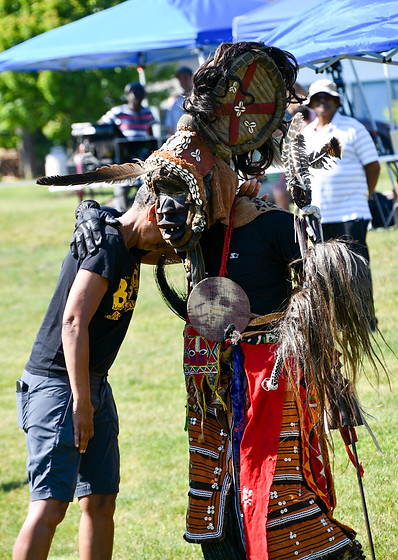 Photo of Chief Nze giving blessings to a black woman at the 2022 Juneteenth Commemoration