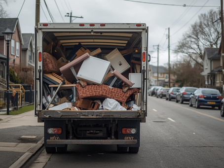 Full Junk Cube van carrying mixed furniture and rubbish during a waste collection in London.