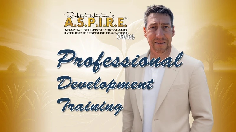 Robert J. Norton stands confidently in a light-coloured blazer beside the message: “Protecting ourselves shouldn’t be a conflict!” The image promotes A.S.P.I.R.E.™ Online, a trauma-aware coaching program helping people protect their peace and respond with calm, confidence, and clarity.