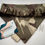 Thumbnail: An elastic outdoor pet bandana in green and beige camo