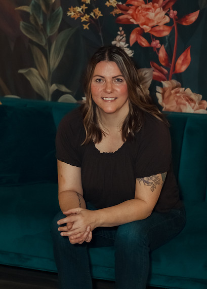 Bobbi Gorsalitz sitting on a blue couch