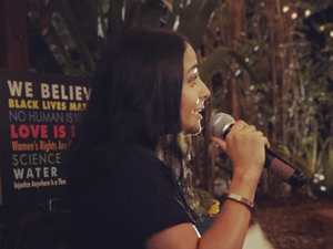 BI-NAR artist giving a speech
