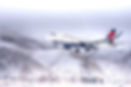delta airlines taking off on in the snow