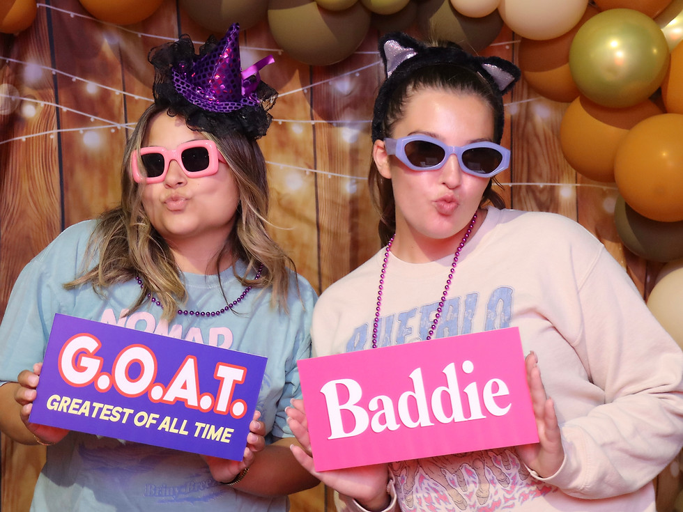 Friends posing with props from an online photo booth rental
