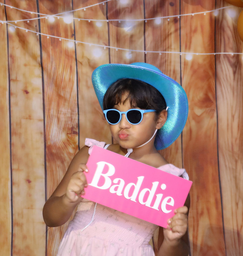 Girl posing with 'Baddie' sign in an online photo booth rental