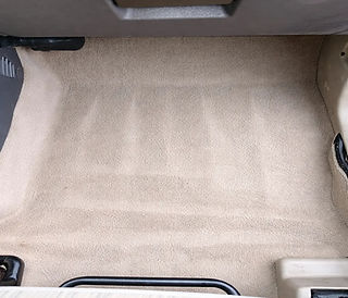 Before and after interior car detailing floor cleaning in Onalaska WI by Mack2Steam showing removal of dirt and stains