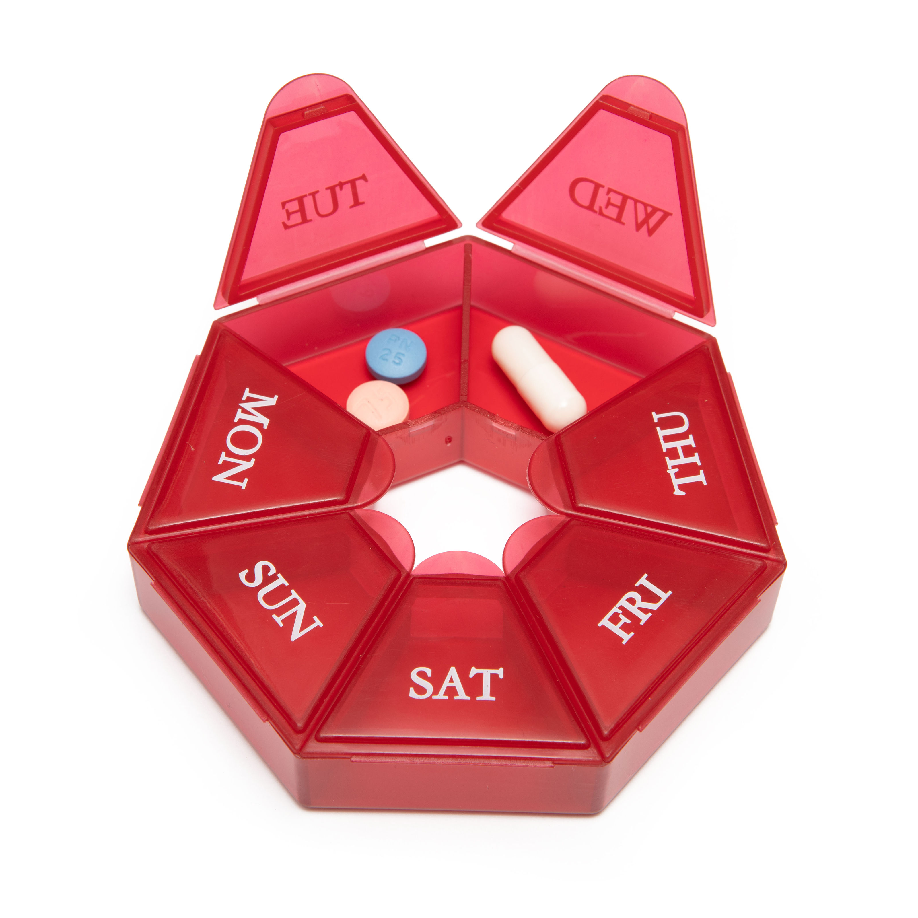 Red weekly pill organizer with pills
