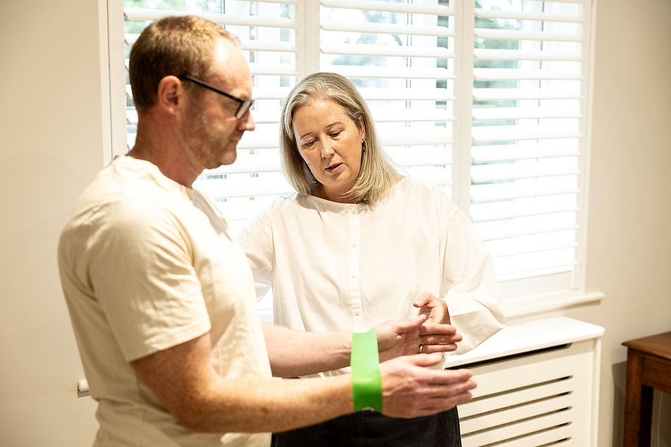 chiropractor instructing on exercise therapy