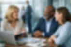 Business meeting with three people smiling and asking "What does fractional HR do?"