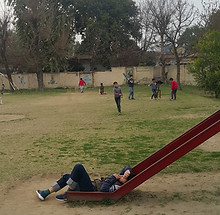 Autistic kid on slide alone