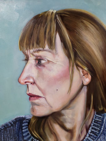 Side profile painting of a woman's face 