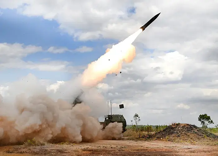 Landscape photo of a rocket artillery system launching a missile, suitable to visually represent LAND 8113 Phase 2 Second Long Range Fires Regiment.