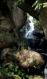 Saxon Switzerland landscape with stones and cliffs and a waterfall