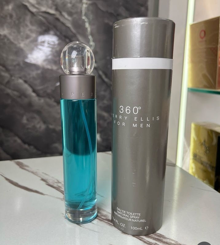 Vista frontal frasco y caja perfume 360° Perry Ellis for Men de 100ml con fondo marmol