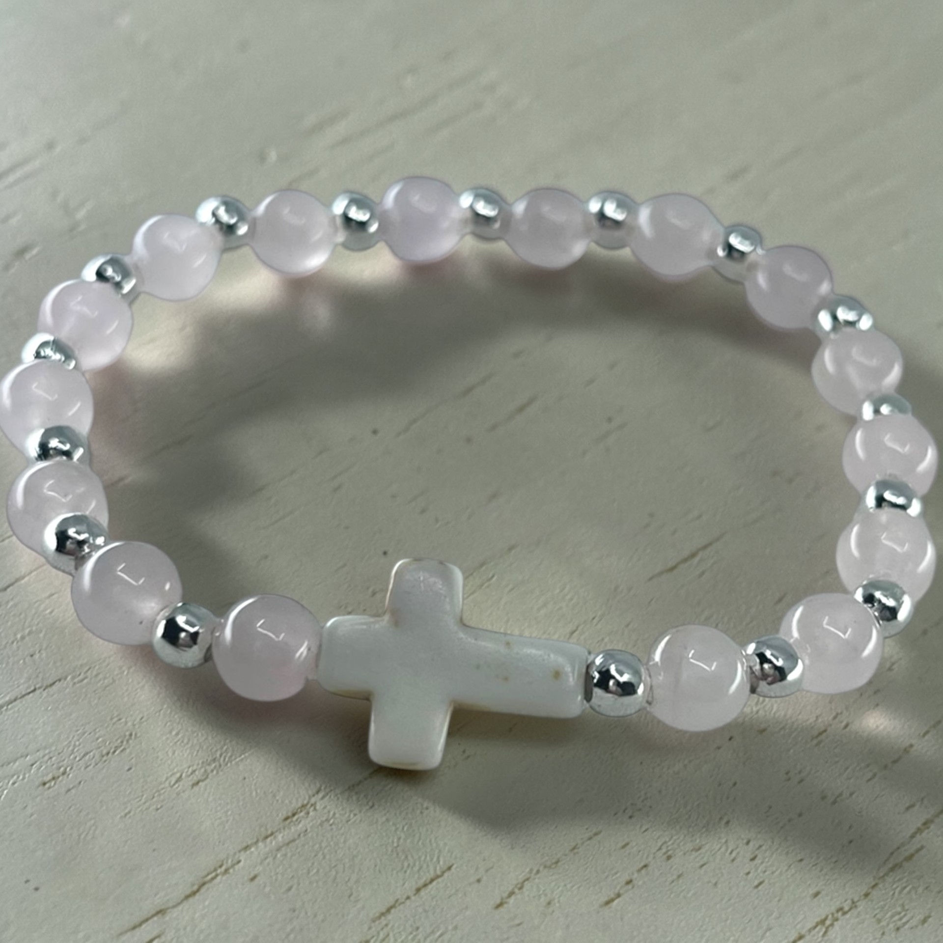 6mm rose quartz cross bracelet with pink gemstone beads and silver accents