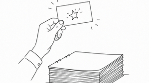Black and white line illustration of a hand holding a business card with a doodle above a discarded stack of presentation pages