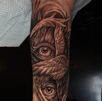 black and gray wing tattoo Xavier Melo