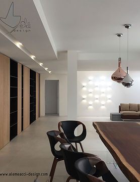 zona living con open space : arredamento su misura con una parete attrezzata in legno, interni luminosi ed eleganti