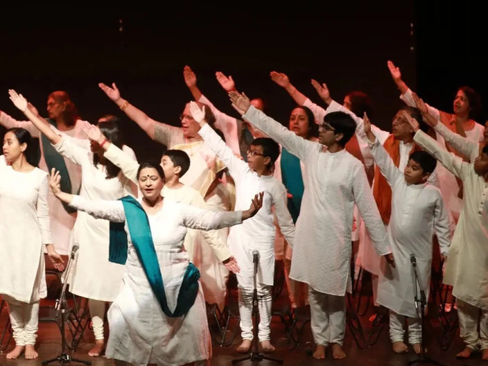 An exciting singing performance on stage, with a performer showcasing talent and captivating the audience with their voice.