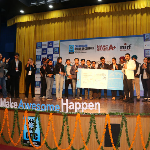 The Creativelo winner stands on stage, proudly receiving recognition for their achievement.