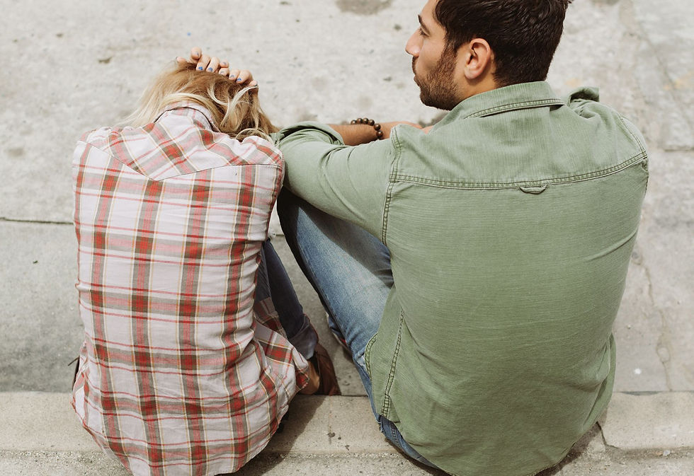 Couple sitting on curb